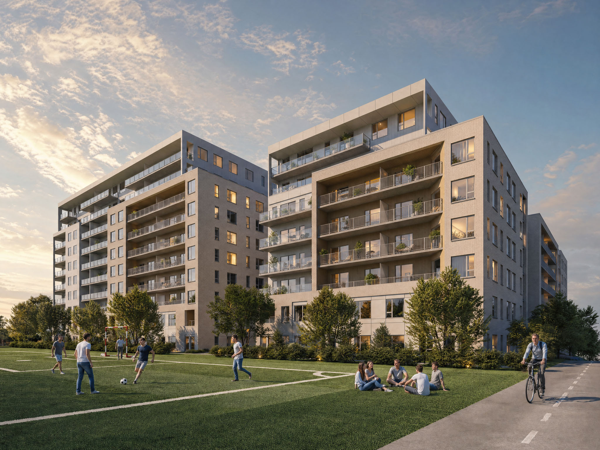 Rendu des immeubles du Carré Mathieu au coucher du soleil, vus depuis le parc Saint-Mathieu et sa piste cyclable